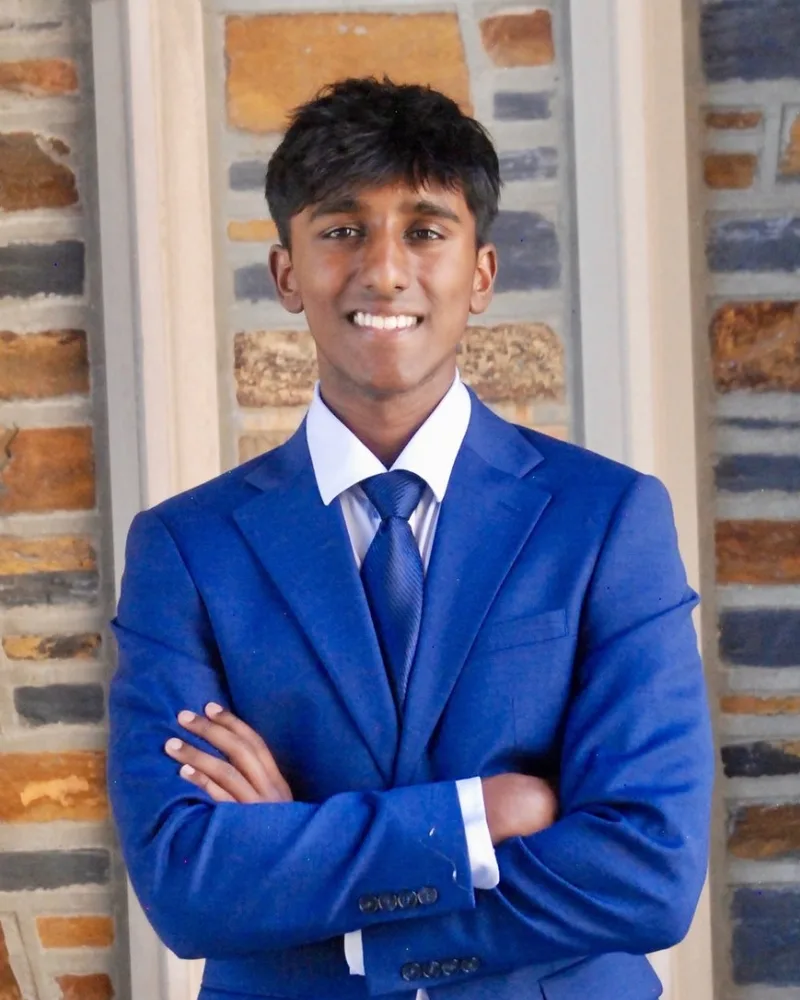 Shrivathsan Sakthisundaram in a blue suit at Duke Chapel